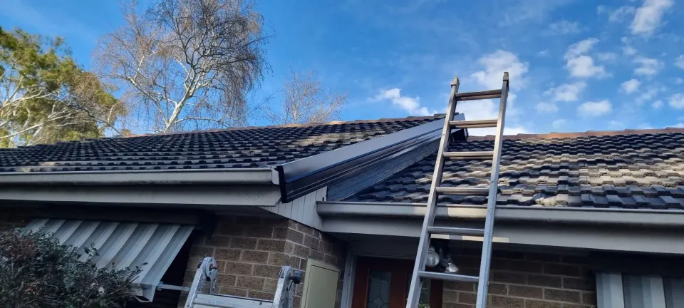 New Colorbond gutter and fascia being installed on a Melbourne home