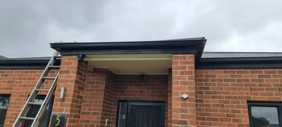 Storm-damaged eave & fascia — repaired — after