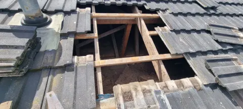 Tiled roof opened back to the battens and framing on a Melbourne job