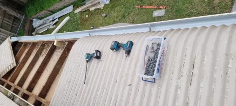 New metal roof sheeting going on during a Melbourne roof replacement