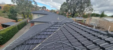 Tiled roof restored in a slate grey finish in Melbourne