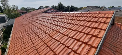 Restored terracotta roof with new ridge capping in Melbourne