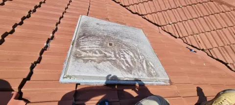 Before — a weathered, clouded skylight dome on a tiled roof in Melbourne