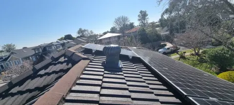 Whirlybird roof vent fitted to a charcoal tiled roof in Melbourne