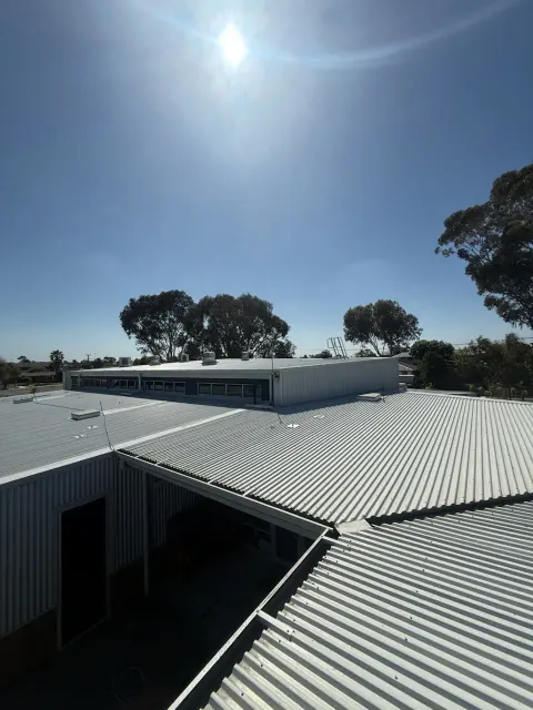 Cleaned commercial metal roofs across adjoining buildings on a Melbourne commercial site